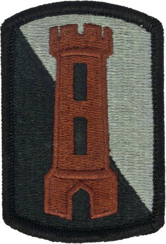 Embroider patch with a brown tower design on a green and black background