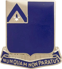 Metal unit crest with blue background, gold border, and text 'Nunquam Non Paratus'.