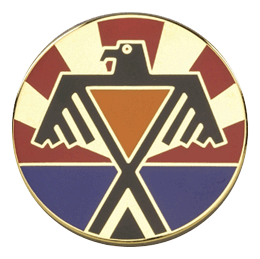 Circular emblem with a stylized eagle design on a white background