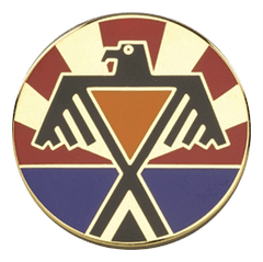 Circular emblem with a stylized eagle design on a white background