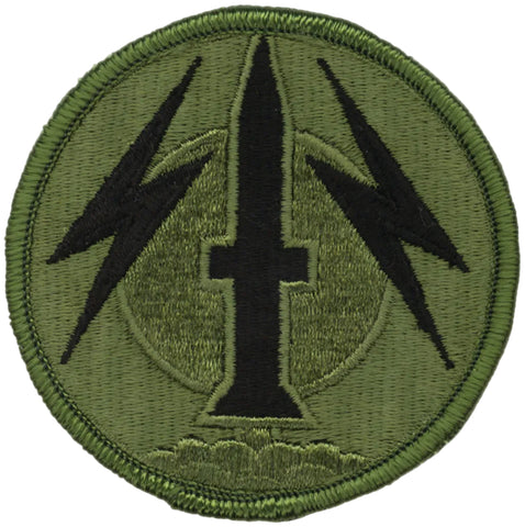 Green patch with black symbol on a white background