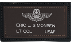 Printed  leather name tag patch with military insignia and text on a brown background