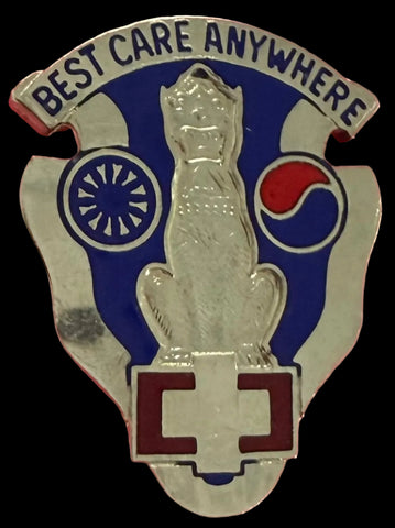 Metal unit crest with 'Best Care Anywhere' text and a logo on a silver metal