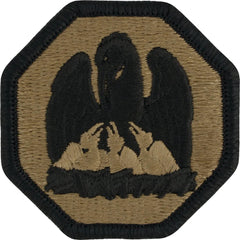 Hexagonal patch with embroidered design of an eagle feeding its eaglets on a green background