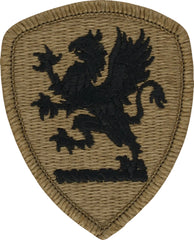 Olive green patch with black embroidered design of a lion on a white background