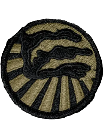 Round embroidered patch with green background and emblem in black