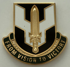 metal unit crest with a gold sword.