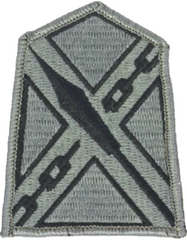 ACU Military patch with a distinctive emblem on a gray background