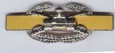 Combat Armor badge in yellow by Saunders Military Insignia